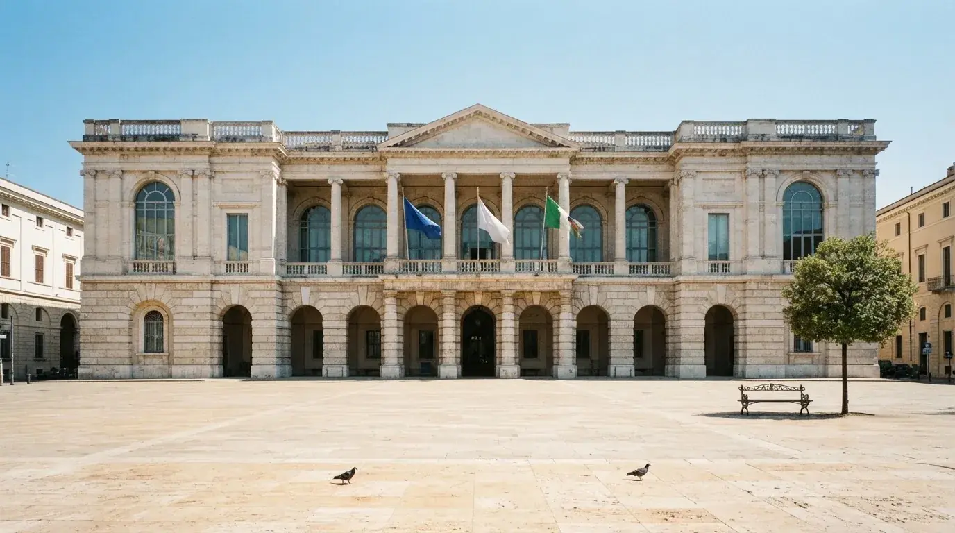 Palazzo istituzionale con bandiere al vento in una piazza soleggiata — casinò che accettano bitcoin